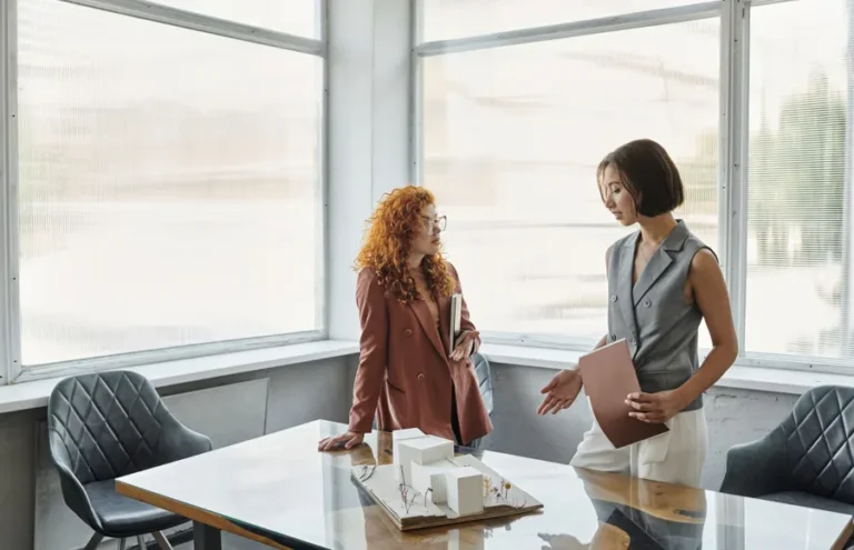 Two women discussing a career as a Utah Realtor
